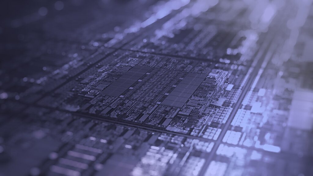 Close-up view of a computer microchip or processor, showing intricate circuitry and electronic components with a blue and purple colour overlay.